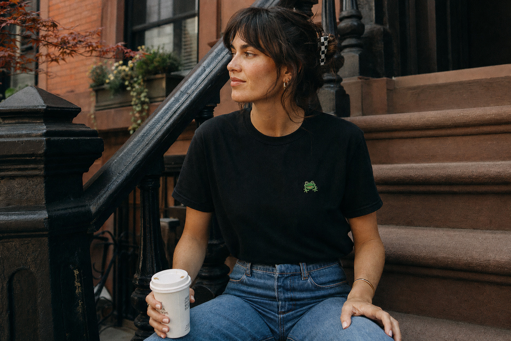 Lifestyle — black tee with toad mark, brownstone steps