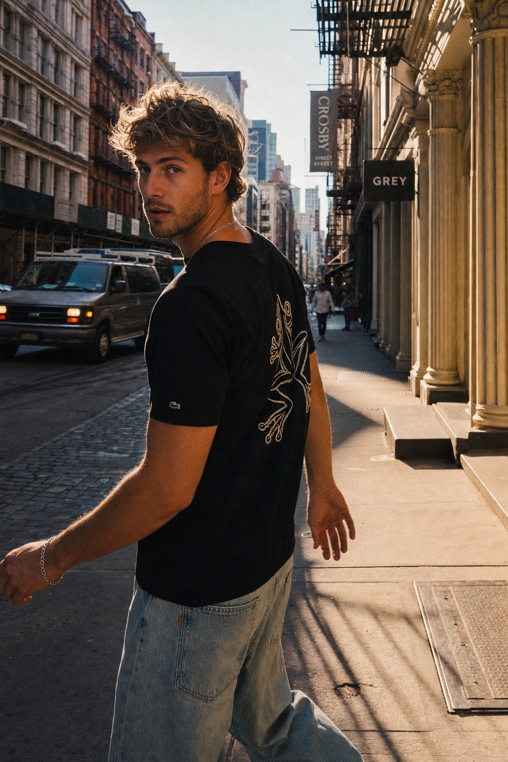 Lifestyle — black tee with toad mark, SoHo morning